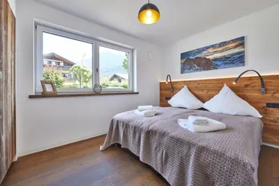 Ein Bett oder Betten in einem Zimmer der Unterkunft Sunshine Apartment Spirit of Deer