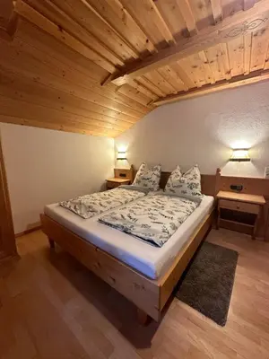 Ein Bett oder Betten in einem Zimmer der Unterkunft Ferienwohnung Haus Reindl
