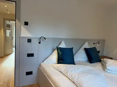 Ein Bett oder Betten in einem Zimmer der Unterkunft Hoixl Gütl auf der Fraueninsel