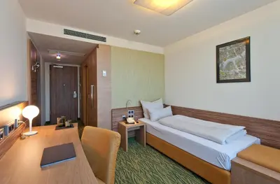 Ein Bett oder Betten in einem Zimmer der Unterkunft Hotel Bildungsblick