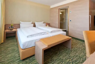 Ein Bett oder Betten in einem Zimmer der Unterkunft Hotel Bildungsblick