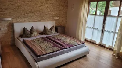 Ein Bett oder Betten in einem Zimmer der Unterkunft Apartment KOFELBLICK mit Bergblick und KÖNIGSCARD