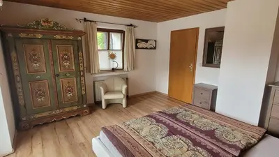 Ein Bett oder Betten in einem Zimmer der Unterkunft Apartment KOFELBLICK mit Bergblick und KÖNIGSCARD