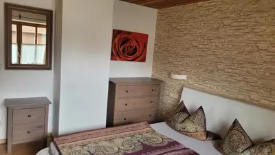Ein Bett oder Betten in einem Zimmer der Unterkunft Apartment KOFELBLICK mit Bergblick und KÖNIGSCARD