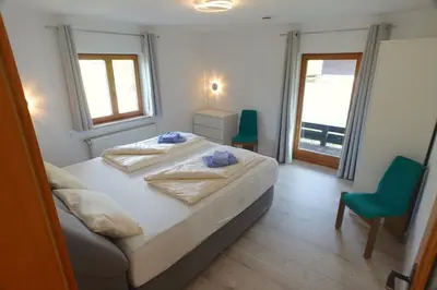 Ein Bett oder Betten in einem Zimmer der Unterkunft Loisachglück