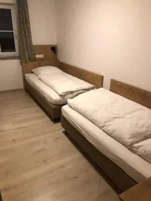 Ein Bett oder Betten in einem Zimmer der Unterkunft Pension Beil