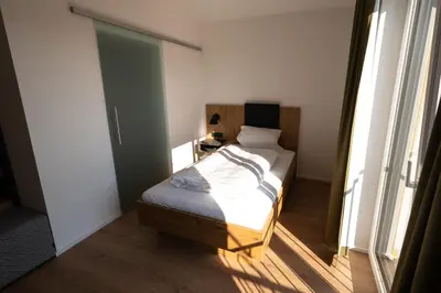 Ein Bett oder Betten in einem Zimmer der Unterkunft HeindlHof