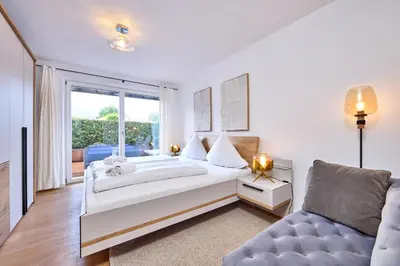 Ein Bett oder Betten in einem Zimmer der Unterkunft AlpenAmbiente