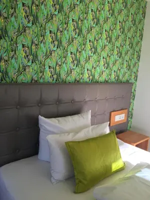 Ein Bett oder Betten in einem Zimmer der Unterkunft Hotel im Bunker