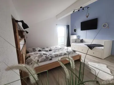 Ein Bett oder Betten in einem Zimmer der Unterkunft Ferienwohnung Chiemseeliebe