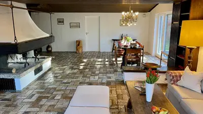 Ein Sitzbereich in der Unterkunft Large holiday apartment with sauna, terrace, garden and open fireplace