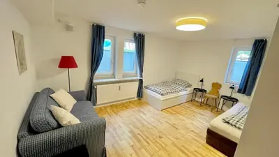 Ein Bett oder Betten in einem Zimmer der Unterkunft Large holiday apartment with sauna, terrace, garden and open fireplace