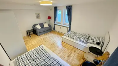 Ein Bett oder Betten in einem Zimmer der Unterkunft Large holiday apartment with sauna, terrace, garden and open fireplace