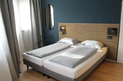 Ein Bett oder Betten in einem Zimmer der Unterkunft ARRIVEL Apartements Heimstetten - bisher Novitel