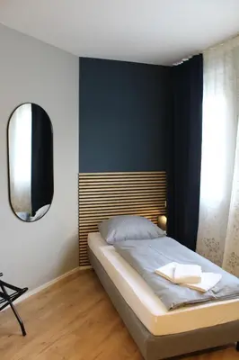 Ein Bett oder Betten in einem Zimmer der Unterkunft ARRIVEL Apartements Heimstetten - bisher Novitel