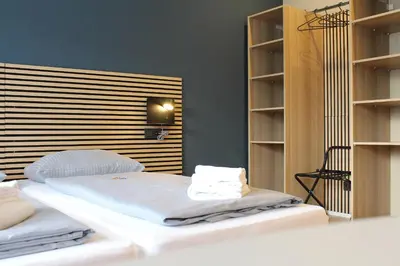 Ein Bett oder Betten in einem Zimmer der Unterkunft ARRIVEL Apartements Heimstetten - bisher Novitel