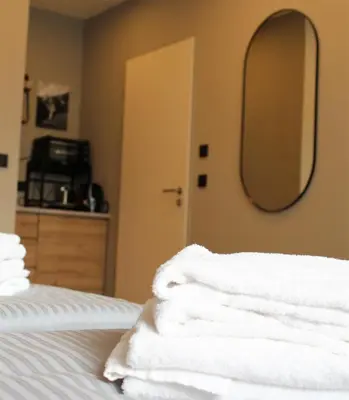 Ein Bett oder Betten in einem Zimmer der Unterkunft ARRIVEL Apartements Heimstetten - bisher Novitel