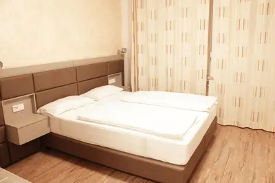 Ein Bett oder Betten in einem Zimmer der Unterkunft Isar City Hotel