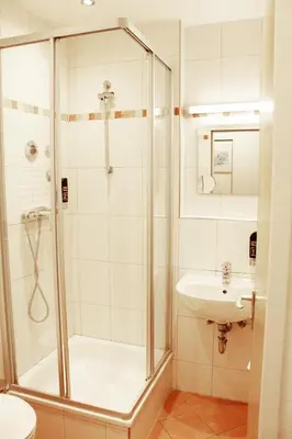 Ein Badezimmer in der Unterkunft Isar City Hotel