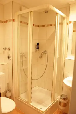 Ein Badezimmer in der Unterkunft Isar City Hotel