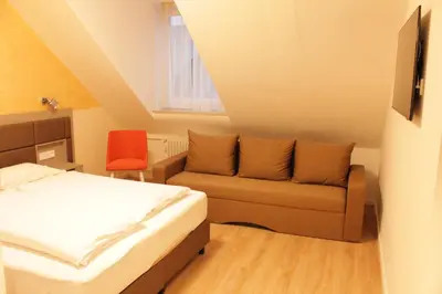 Ein Sitzbereich in der Unterkunft Isar City Hotel