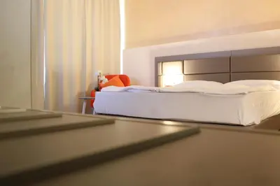 Ein Bett oder Betten in einem Zimmer der Unterkunft Isar City Hotel