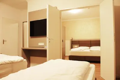 Ein Bett oder Betten in einem Zimmer der Unterkunft Isar City Hotel
