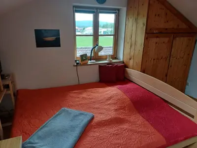 Ein Bett oder Betten in einem Zimmer der Unterkunft Apartment Moosblick zwischen Bergen und See