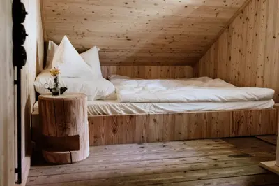 Ein Bett oder Betten in einem Zimmer der Unterkunft Haslauer Hüttn