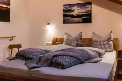 Ein Bett oder Betten in einem Zimmer der Unterkunft Ferienwohnungen Anton Geierstanger