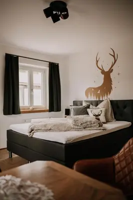 Ein Bett oder Betten in einem Zimmer der Unterkunft Wohnung Hochalm