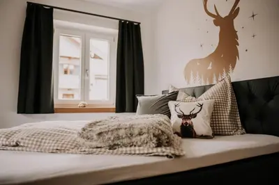 Ein Bett oder Betten in einem Zimmer der Unterkunft Wohnung Hochalm