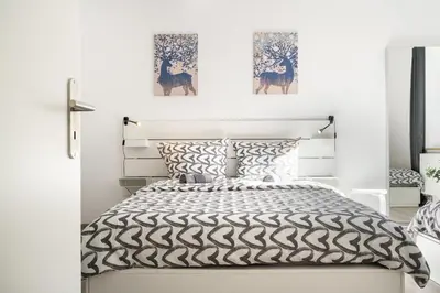 Ein Bett oder Betten in einem Zimmer der Unterkunft Apartment an der Theresienwiese