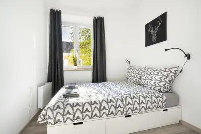 Ein Bett oder Betten in einem Zimmer der Unterkunft Apartment an der Theresienwiese