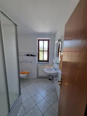 Ein Badezimmer in der Unterkunft Hotel Pension Geiger