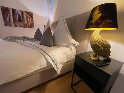 Ein Bett oder Betten in einem Zimmer der Unterkunft Luxuriöses Loft mit großer Sonnenterrasse & Sauna