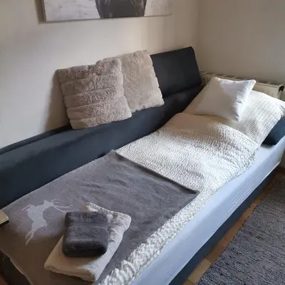 Ein Bett oder Betten in einem Zimmer der Unterkunft 2 Zimmer Ferienwohnung „Schliersberg“