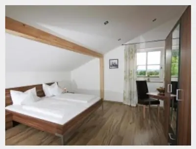 Ein Bett oder Betten in einem Zimmer der Unterkunft L'Ulivo Italienische Restaurant und Pension
