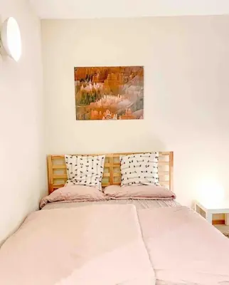 Ein Bett oder Betten in einem Zimmer der Unterkunft See-Appartement Wörthsee