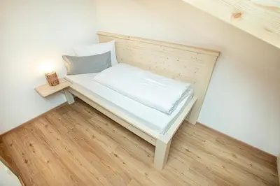 Ein Bett oder Betten in einem Zimmer der Unterkunft Ferienwohnungen 