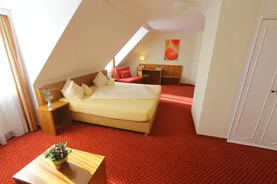 Ein Bett oder Betten in einem Zimmer der Unterkunft Abasto Hotel Eichenau