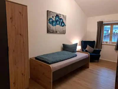 Ein Bett oder Betten in einem Zimmer der Unterkunft Ferienwohnung zum Peterbauer