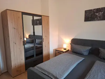 Ein Bett oder Betten in einem Zimmer der Unterkunft Ferienwohnung zum Peterbauer