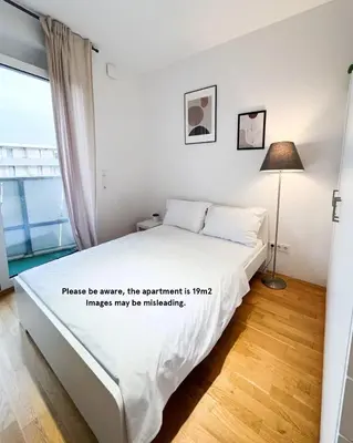 Ein Bett oder Betten in einem Zimmer der Unterkunft My Room Messe Munich Apartment