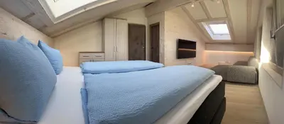 Ein Bett oder Betten in einem Zimmer der Unterkunft Ferienwohnung Atelier Simetsberg