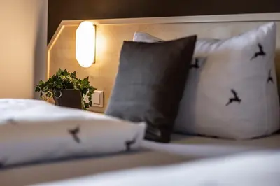 Ein Bett oder Betten in einem Zimmer der Unterkunft Brauereigasthof Hofmark