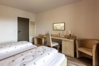 Ein Bett oder Betten in einem Zimmer der Unterkunft Brauereigasthof Hofmark