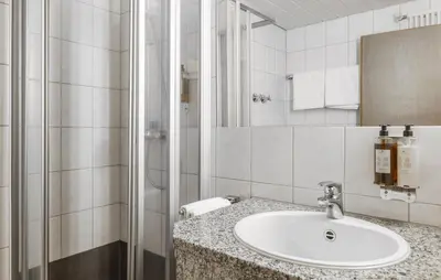 Ein Badezimmer in der Unterkunft Brauereigasthof Hofmark