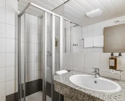 Ein Badezimmer in der Unterkunft Brauereigasthof Hofmark
