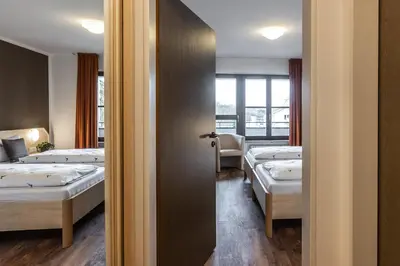 Ein Bett oder Betten in einem Zimmer der Unterkunft Brauereigasthof Hofmark